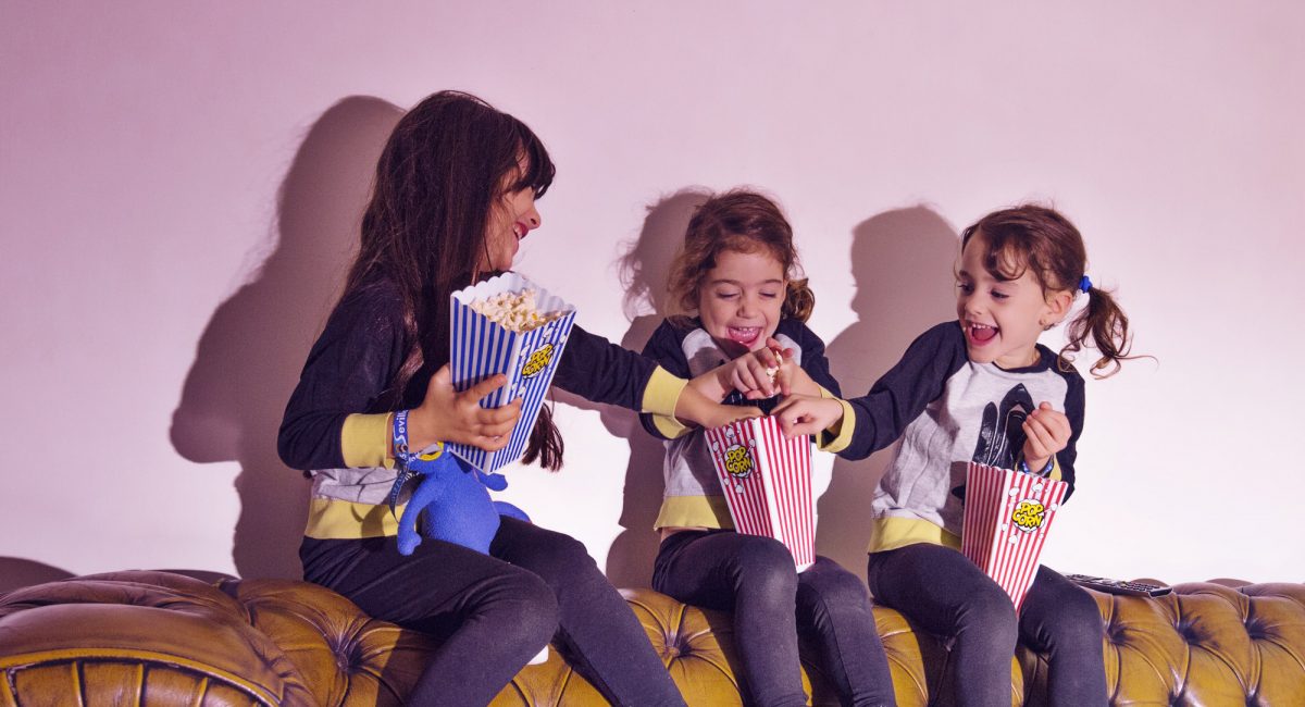 playing-little-girls-with-popcorn-couch